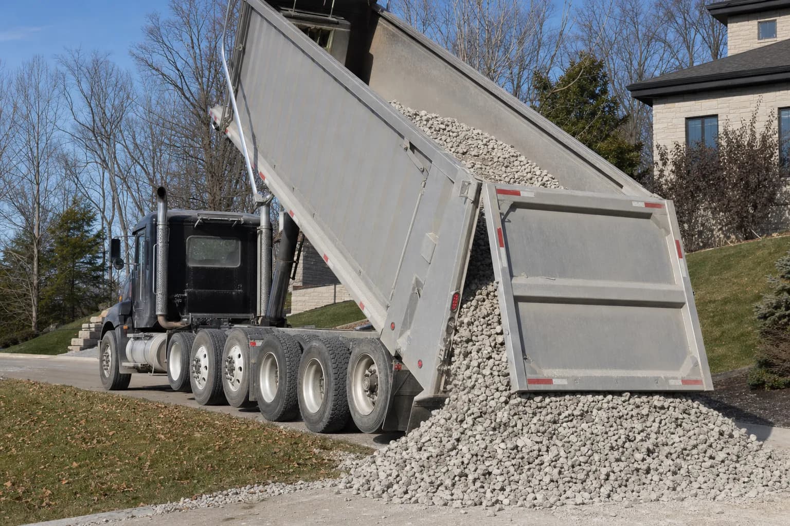 Dump truck delivering gravel